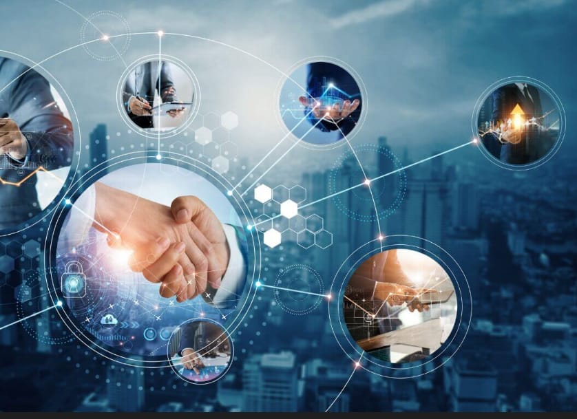 The image depicts a handshake between two people in business attire, symbolizing partnership or agreement. The handshake is at the center of a network of circles containing images of people interacting with technology like phones and laptops. There's a cityscape in the background with a blue tone. Graphics like lines, hexagons, and a lock icon suggest themes of connectivity, data, security, and business collaboration. 