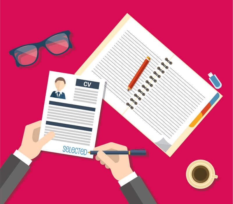 Illustration of a workspace with a person holding a CV that has the word "SELECTED" written at the bottom. A notebook with a pencil, a pair of glasses, a USB drive, and a cup of coffee are placed on the desk with a bright pink background.
