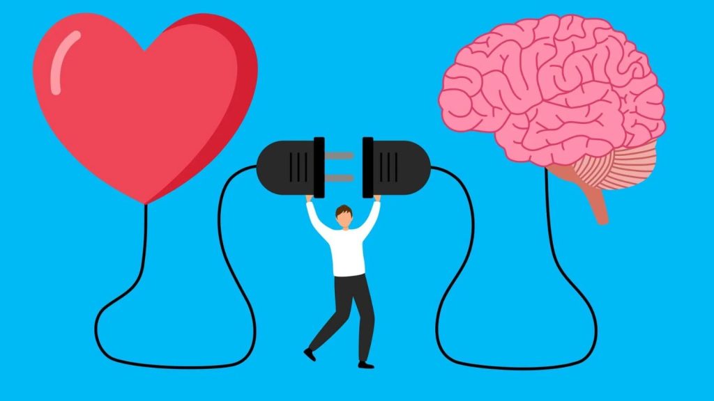 This image is a conceptual illustration of Emotional Intelligence (EI):

On the left, there’s a heart, representing emotions and empathy.

On the right, there’s a brain, representing logic, reasoning, and decision-making.

In the middle, a person is holding a plug connector, symbolizing the idea of connecting heart and mind—balancing emotions with rational thinking.